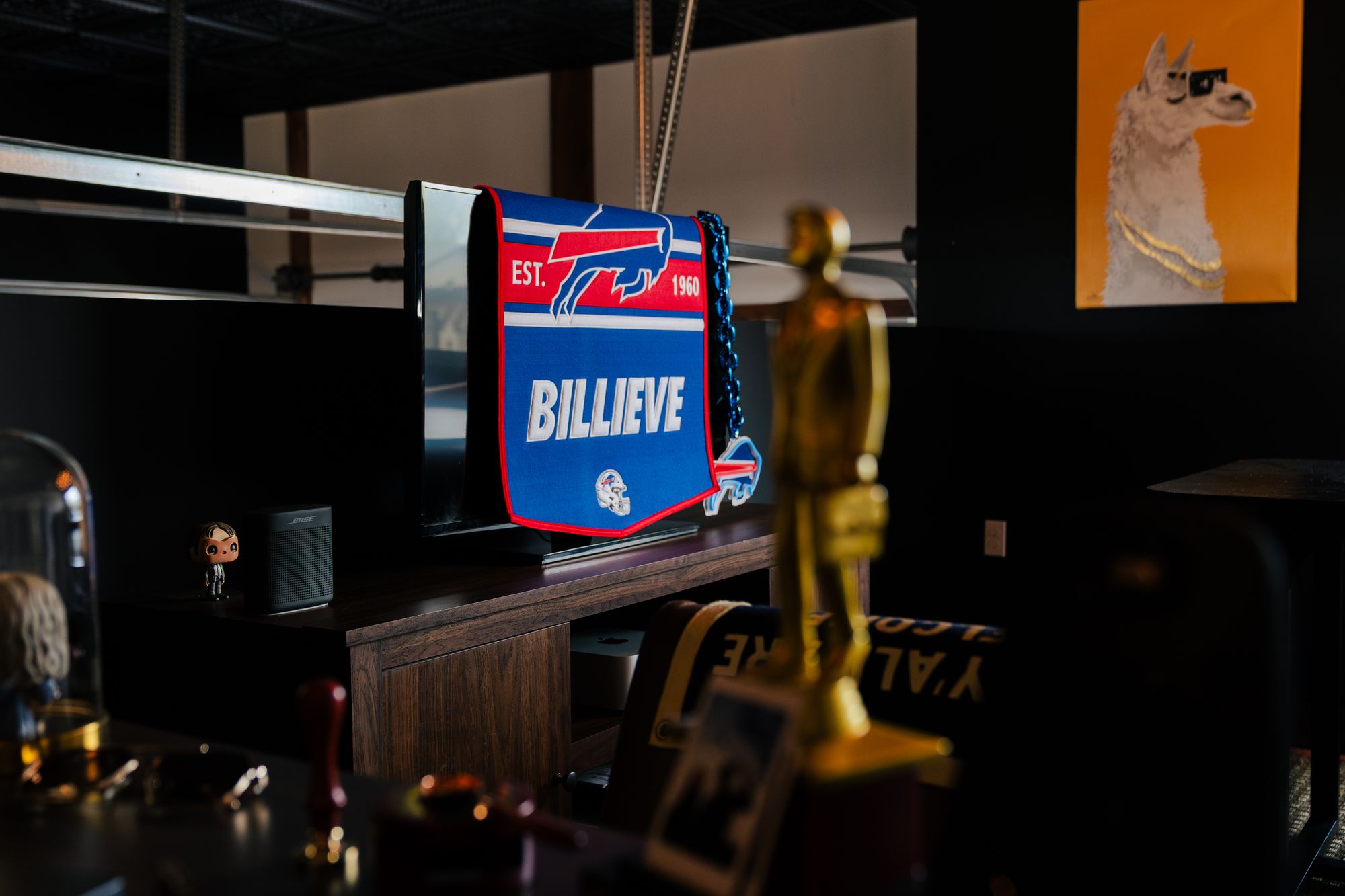 A Buffalo Bills flag on the wall at the bahlr studio
