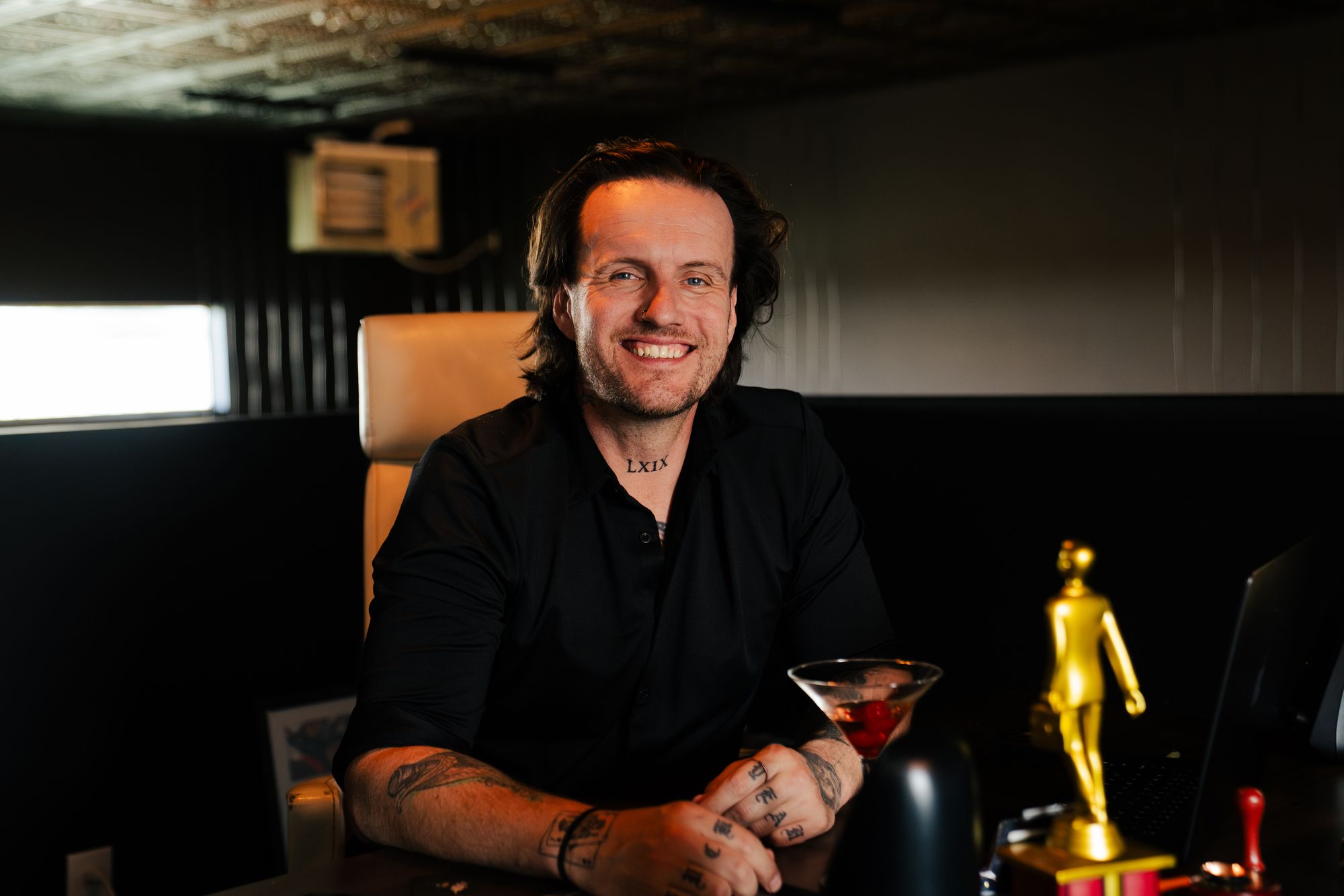 Corey Jeppesen at the bahlr studio with one of bahlr’s awards